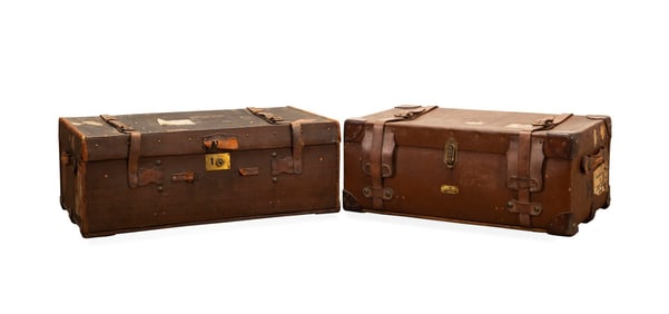 TWO ENGLISH TRAVEL TRUNKS WITH LUGGAGE LABELS