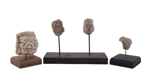 FOUR DIMINUTIVE ANCIENT CARVINGS ON CUSTOM STANDS