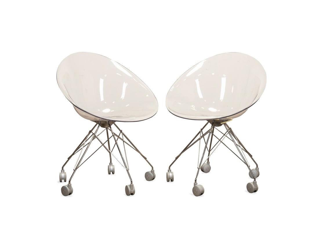 STARCK FOR KARTELL, 'ERO S' WIRE BASE CHAIRS: Philippe Starck (French, born 1949) for Kartell (Italian, founded 1949), contemporary. Pair of "Ero S" or "Eros" colorless polycarbonate chairs, each having a chrome wire base with casters, appropriat
