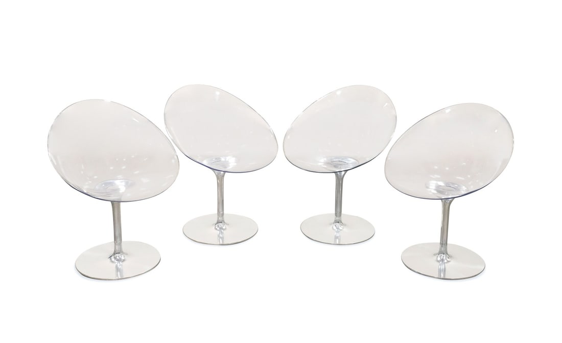 STARCK FOR KARTELL, 4 'ERO S' PEDESTAL CHAIRS: Philippe Starck (French, born 1949) for Kartell (Italian, founded 1949), contemporary. Set of four "Ero S" or "Eros" colorless polycarbonate chairs, each having an aluminum pedestal, appropriately mar
