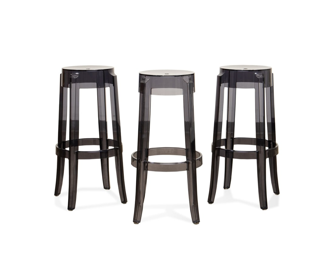 STARCK FOR KARTELL, THREE 'CHARLES GHOST' STOOLS: Philippe Starck (French, born 1949) for Kartell (Italian, founded 1949), contemporary. Set of three "Charles Ghost" smoke grey polycarbonate stools, appropriately marked. Approximate dimensions: h. 29