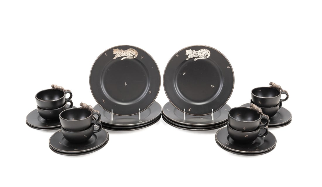 EMILIA CASTILLO JAGUAR MOTIF DINNERWARE, 24 PIECES: Emilia Castillo (Mexican, born 1958), 20th century. Set of 24 pieces of jaguar motif silver overlay black ceramic partial dinnerware comprising eight dinner plates (dia. 9.5"), eight cups (h. 2.75"),