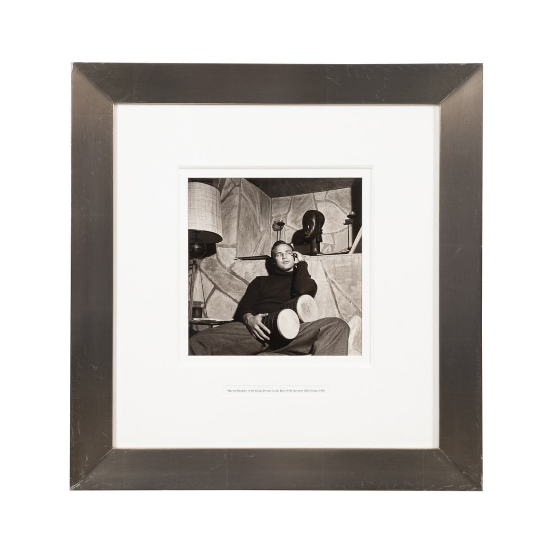 SID AVERY, 1955 MARLON BRANDO, B&W PHOTO: Sid Avery (American, 1918-2002). "Marlon Brando; with Bongo Drums in the Den of His Beverly Glen House" - 1955, silver gelatin print, signed, titled, dated and numbered 13/70 to verso. Framed. Approxi
