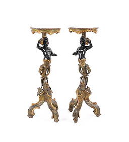 PAIR OF 19TH C. ITALIAN BLACKAMOOR PLANT STANDS: Italian, 19th century. Pair of carved wooden Blackamoor tables or plant stands, each having polychrome decoration with gilt accents, and rising on a triparte scrolled base, apparently unmarked. Proven