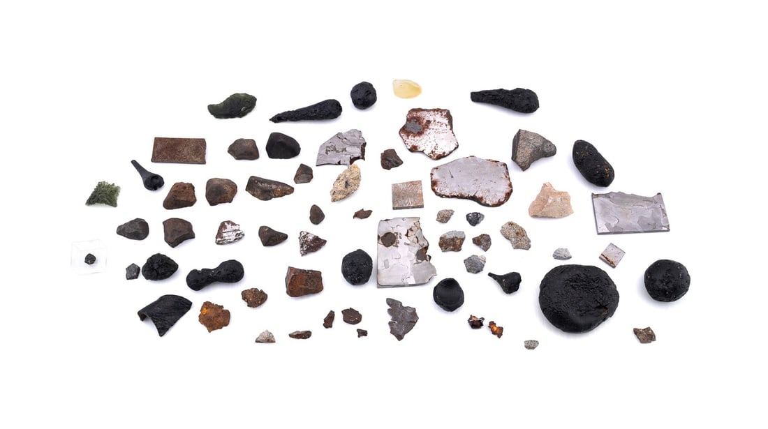 METEORITES, TEKTITES, MOLDAVITES AND IMPACTITES: Large grouping of meteorites, tektites, moldavites, and impactites, totaling approximately 60 specimens, 41 of which are meteorites. The group includes examples from notable falls such as El Hammami,