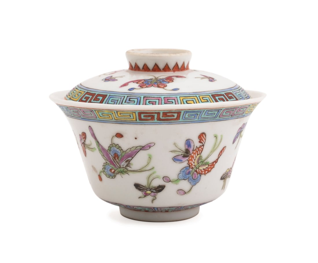 CHINESE FAMILLE ROSE BUTTERFLY COVERED TEA BOWL: Chinese. Famille Rose porcelain tea bowl and cover, decorated with butterflies and moths, the lid and bowl having a Qianlong type overglaze mark, the interior of the bowl with wax export seal and pape