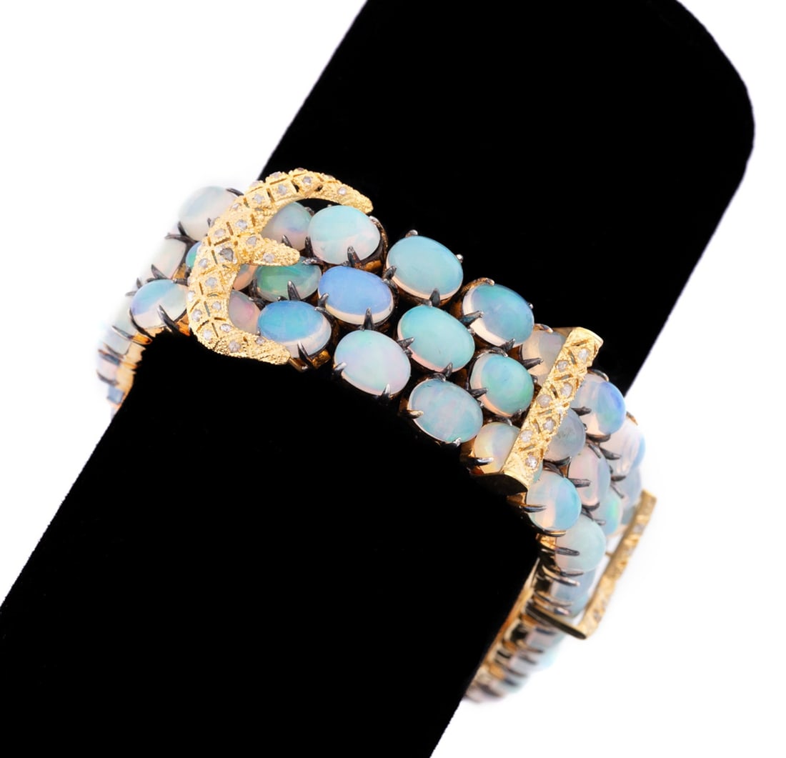 40CTW OPAL & DIAMOND THREE ROW BUCKLE BRACELET: Opal and diamond three row buckle bracelet in vermeil sterling silver and 14k yellow gold hidden box clasp, with (49) rose cut diamonds weighing approximately 0.37 total carats and (75) oval cabochon