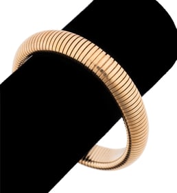 FORSTNER, VINTAGE 'GASPIPE' 14K YELLOW GOLD BANGLE