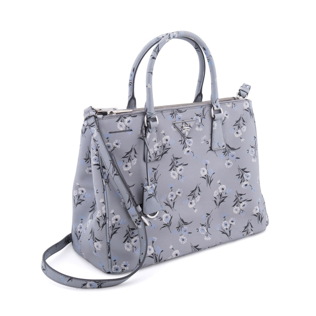 PRADA FLORAL SAFFIANO LEATHER GALLERIA TOTE: Prada (Italian, founded 1913). Floral print saffiano leather tote with two top handles, silver toned hardware, and canvas interior lining. Accompanied by authenticity card and dust bag. Approximate me