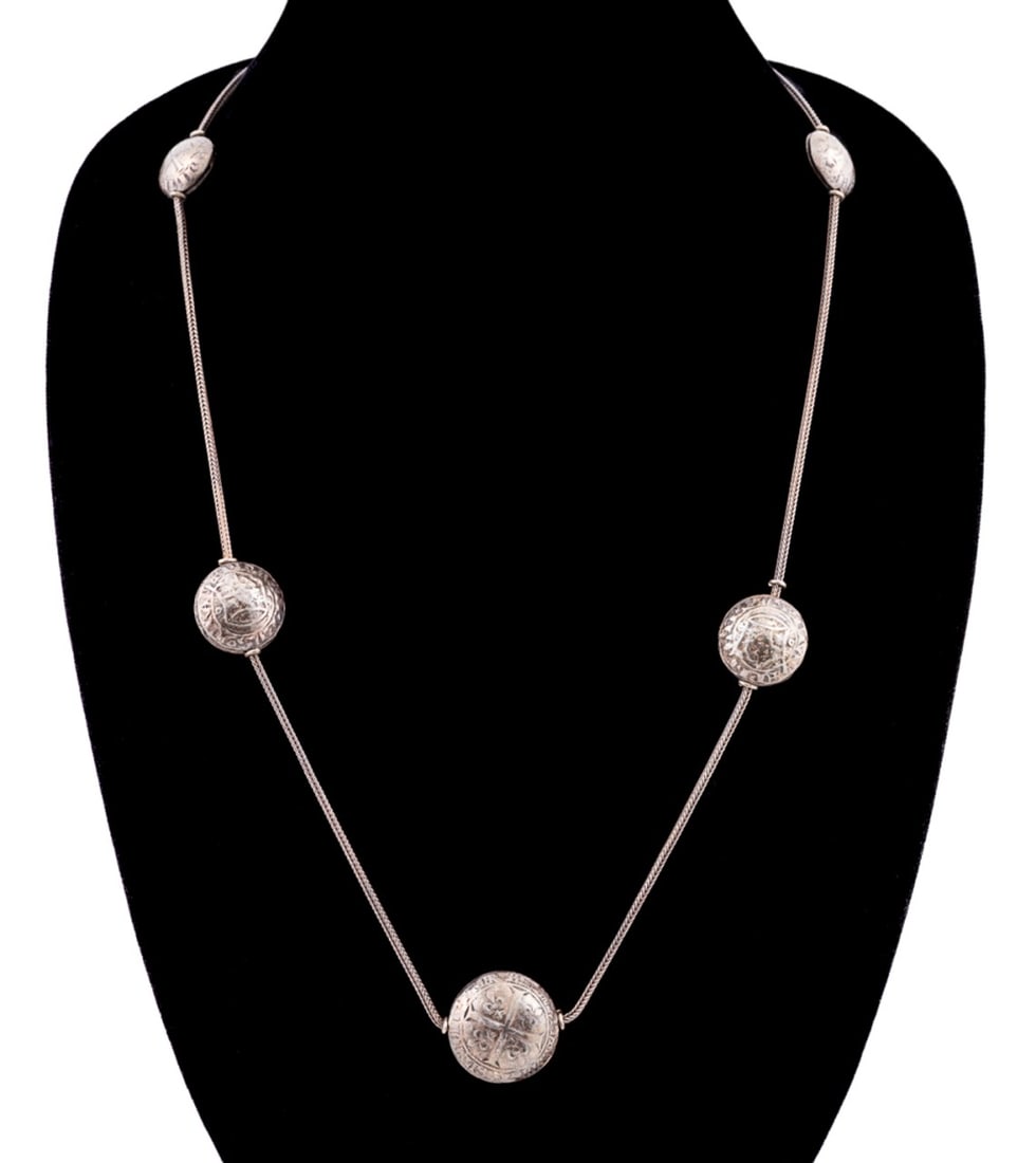 TWO FRENCH GRADUATING COIN SILVER NECKLACES: Two French medieval style graduating silver coin necklaces, with .800 silver braided link chains. Illegible stamps to ring bail. Provenance: Private Collection, Atlanta, GA. Approximate measurements: