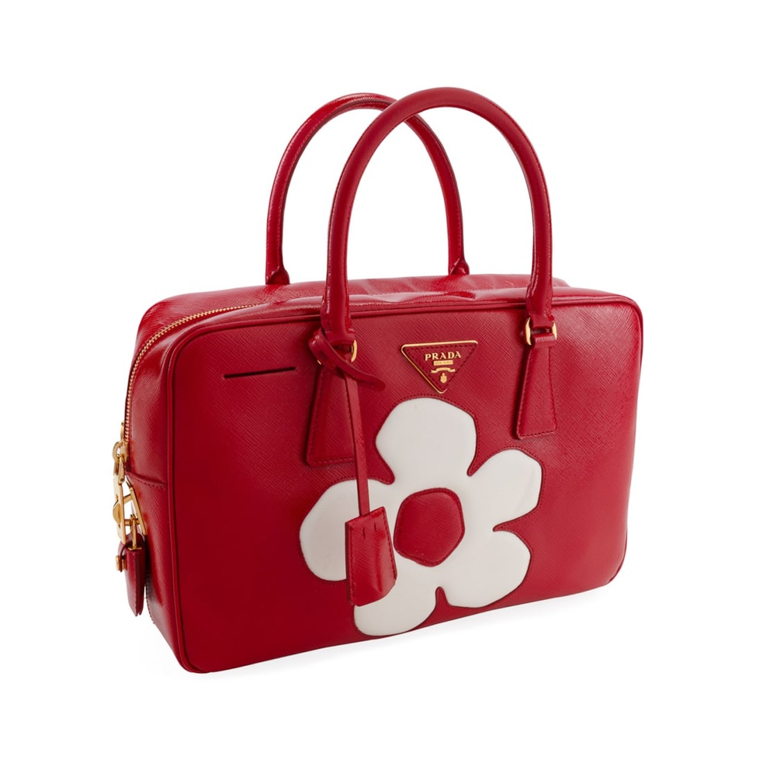 PRADA RED PATENT SAFFIANO LEATHER FLOWER BAG: Prada (Italian, founded 1913). Red patent saffiano leather bag with white floral leather design to front and back, gold toned hardware, and monogram canvas interior lining with leather pockets. Accomp