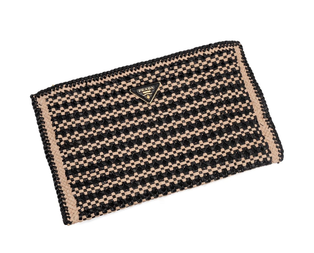 PRADA WOVEN BLACK TAN MADRAS GOAT LEATHER CLUTCH: Prada (Italian, founded 1913), "Made in India" 2010 collection. Black and tan woven Madras goat leather clutch with zip top closure, gold toned hardware, and hand strap on back. Accompanied by origina