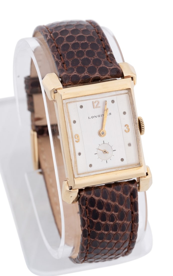 LONGINES 14K YG BROWN LIZARD BAND WRIST WATCH: Longines 14k yellow gold Art Deco style tank cased watch, case No. 255185/162, featuring a manual wind 17 jeweled movement caliber 9L, silver dial with subsidiary second hand dial, domed crystal, tank