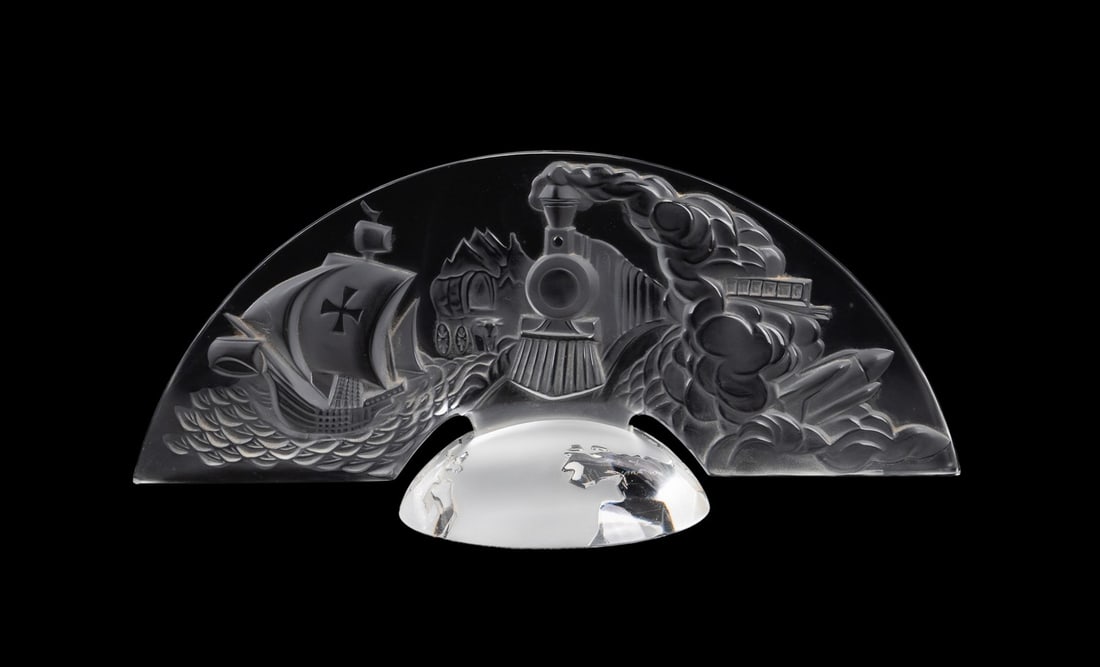 LALIQUE 500TH ANNIVERSARY OF AMERICA PLAQUE: Lalique (French, founded 1888), 1992. Numbered colorless 500th anniversary "Discovery of America" plaque, marked appropriately and numbered 54. Approximate measurements: h. 6", w. 14.25", d. 5.375".