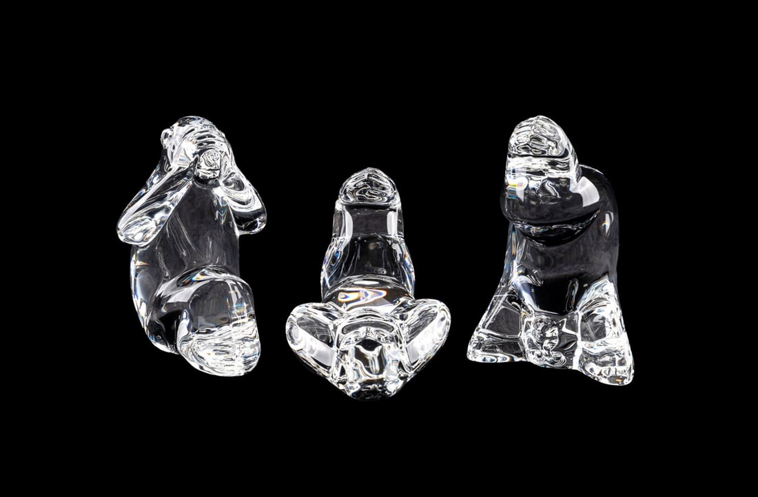 STEUBEN, 'THREE WISE MONKEYS' FIGURES: Taf Lebel Schaefer (American, born 1950) for Steuben (American, founded 1903), late 20th to early 21st century. Set of "Three Wise Monkeys" colorless crystal figures representing "See No Evil", "Hear