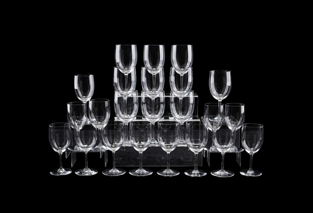 BACCARAT, 23 PIECES OF ASSORTED CRYSTAL STEMWARE: Baccarat (French, founded 1764), 20th century. Assortment of 23 pieces of colorless crystal stemware comprising, in "Perfection" (pattern introduced 1933) 10 water goblets (7.125") and 5 claret wine g