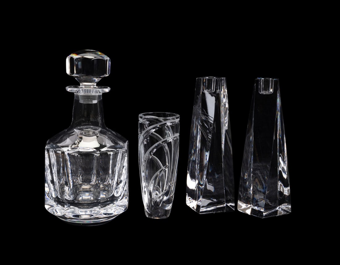 FOUR EUROPEAN COLORLESS CRYSTAL TABLE ARTICLES: Various manufacturers (European), late 20th to early 21st century. Assortment of four colorless crystal table articles comprising, a pair of Orrefors (Swedish, founded 1898) "Tornado" candlesticks (h.