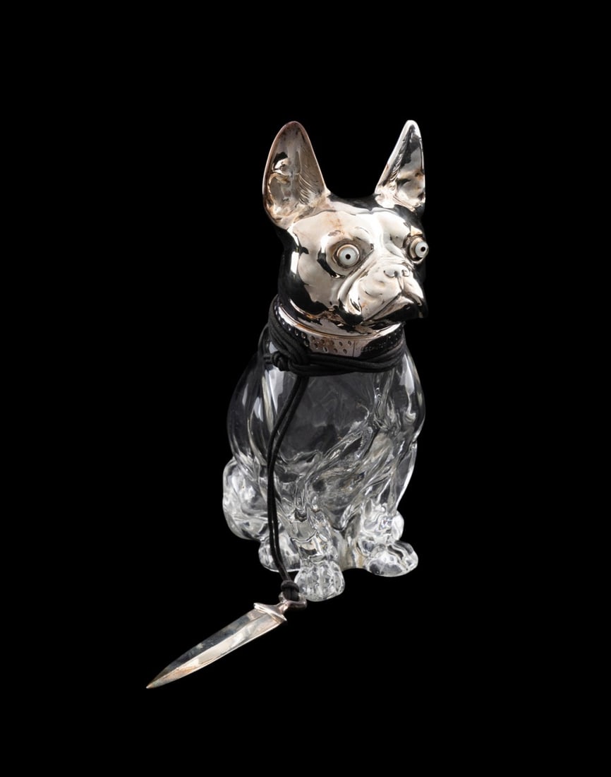 FRENCH BULLDOG SILVERPLATE & GLASS DECANTER: Austrian, first half 20th century. Silverplate and glass French bulldog decanter or scent bottle, having glass eyes and dagger on black cord, the collar engraved "Geschutzt", otherwise apparently unma