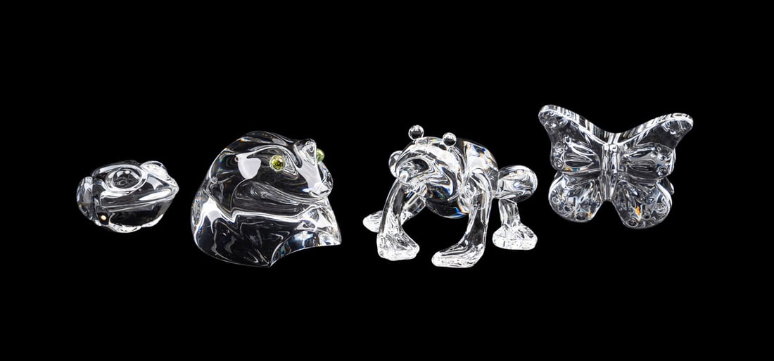 STEUBEN, THREE FROGS AND A BUTTERFLY: Steuben (American, founded 1903), late 20th to early 21st century. Collection of four colorless glass figures comprising three frogs / toads, and a Taf Lebel Schaefer (American, born 1950) designed bu