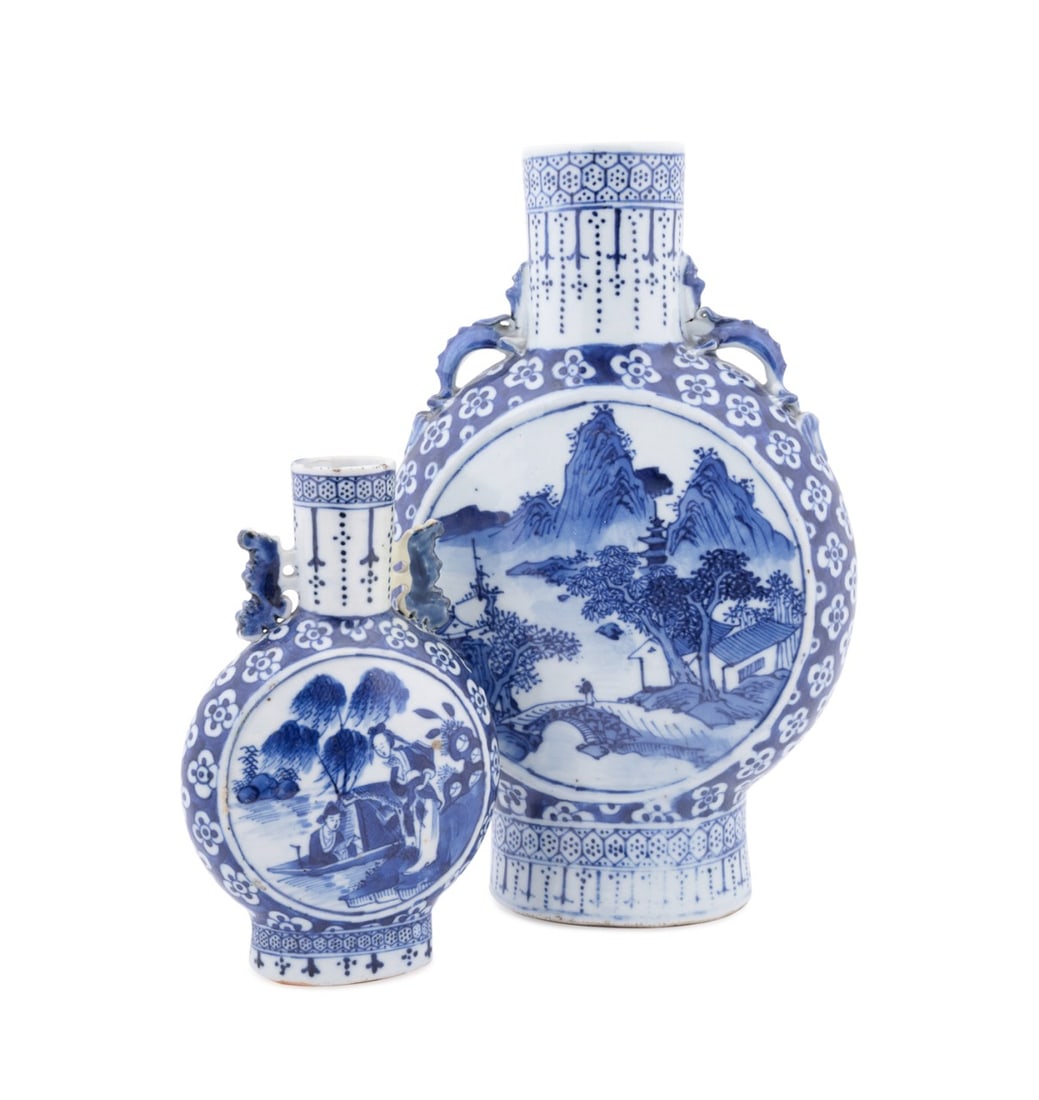TWO CHINESE BLUE & WHITE MOON FLASKS: Chinese. Group of two blue and white porcelain moon flask vases, both with landscapes within roundels on either side, apparently unmarked. Approximate dimensions: tallest h. 10.75", w. 6.75".
