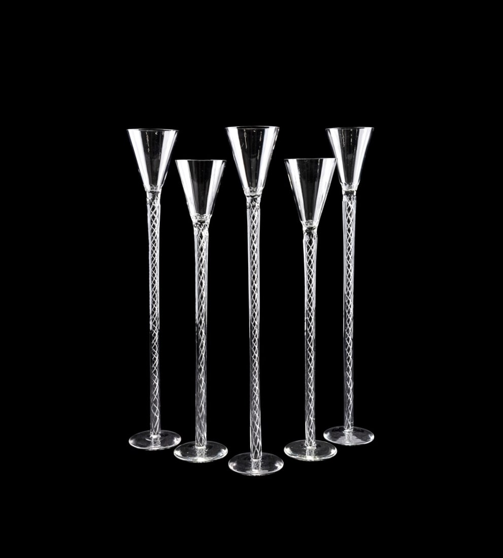 5 OVERSIZED AIR TWIST GLASSES, MANNER STEUBEN: Manner of Steuben (American, founded 1903; American or European. Set of five oversized colorless glass schnapps glasses in the style of the 18th century, each having a partial faceted conical bowl, ai