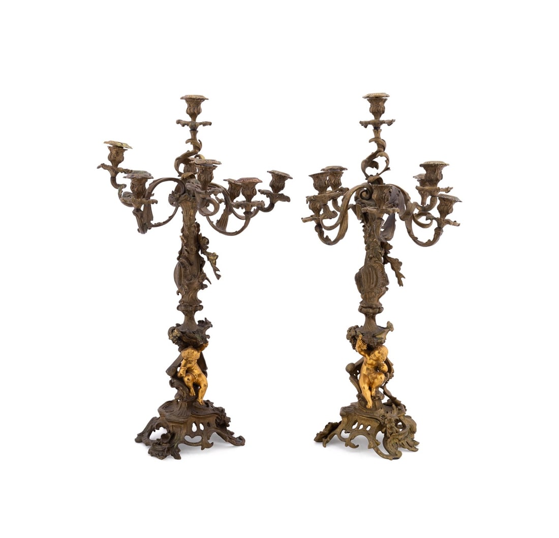 PAIR OF LOUIS XV STYLE GILT BRONZE CANDELABRA: Continental, possibly French, 19th / 20th century. Pair of gilt bronze 9-light candelabra in the Louis XV taste, each having curving acanthus arms on scrolling floral stem with a putto with wine glass
