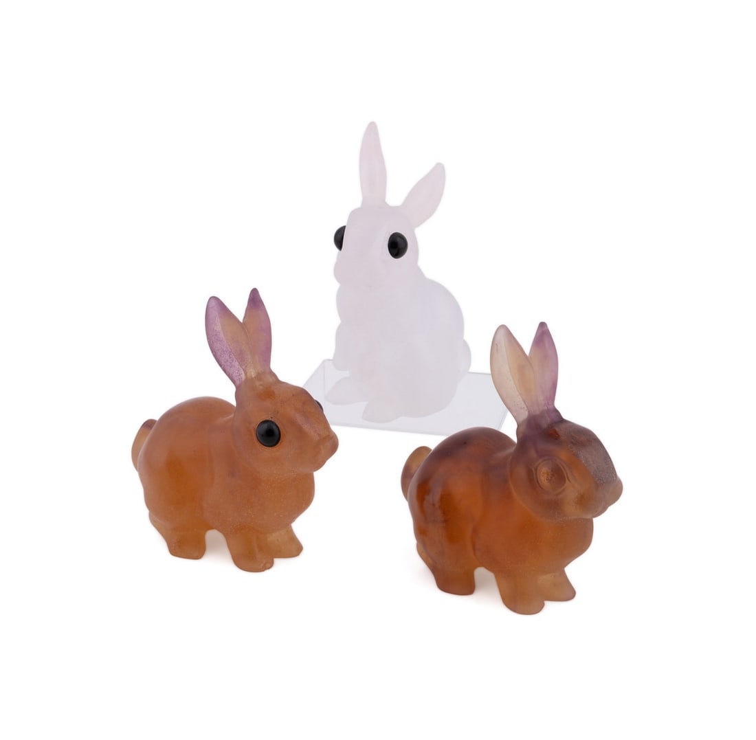 DAUM, SET OF THREE AMBER AND PINK BUNNY FIGURES: Daum (French, founded 1878). Set of three bunnies, including two amber and one light pink, all have acid-etched signatures "Daum France". Provenance: Private Collection of an Esteemed Gentleman, Atlan