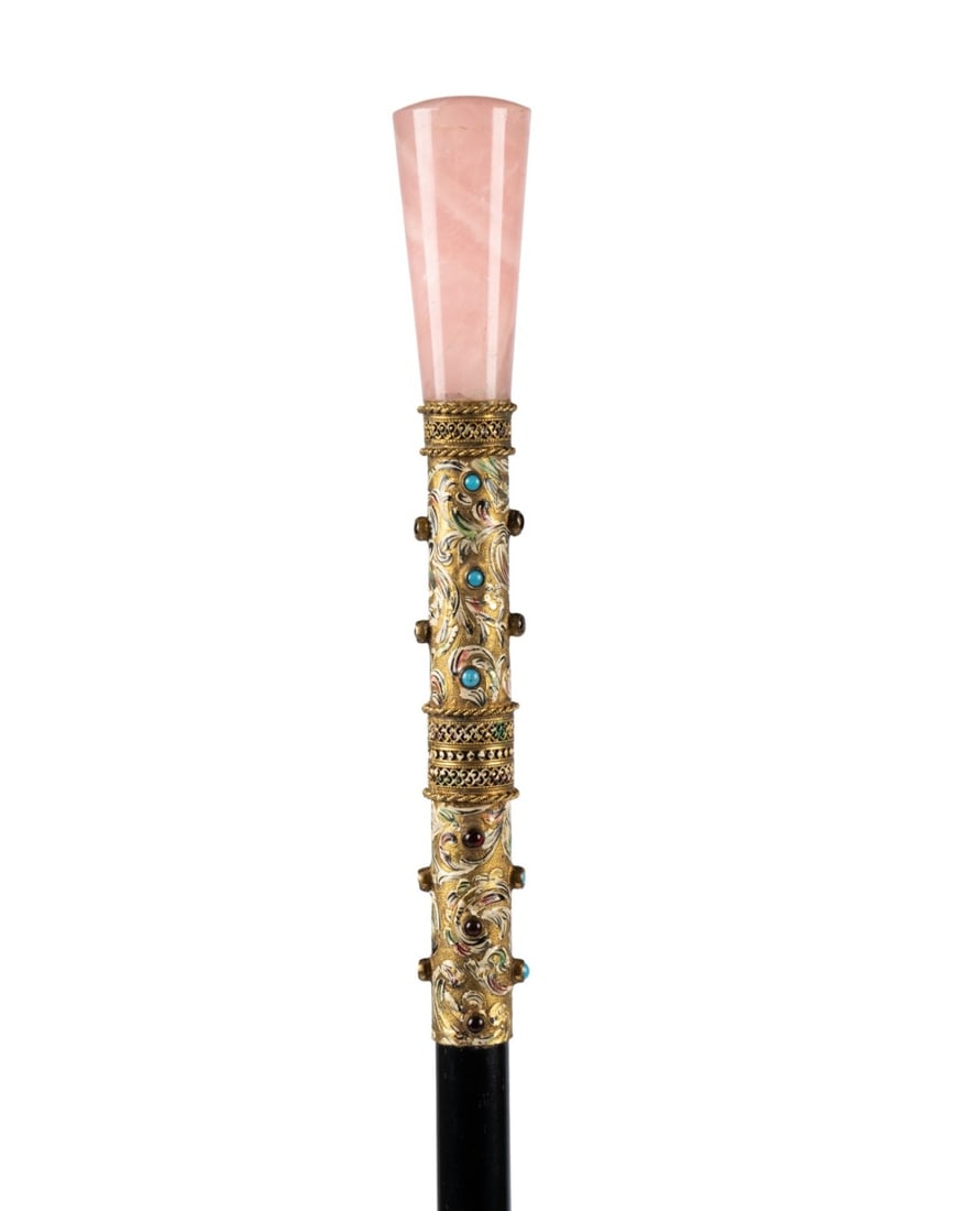 HUNGARIAN ROSE QUARTZ & ENAMEL WALKING CANE: Hungarian, circa 1870. Walking cane with rose quartz top set on silver gilt and enamel handle decorated with semi-precious stones including turquoise and garnet, with ebonized hardwood shaft terminati
