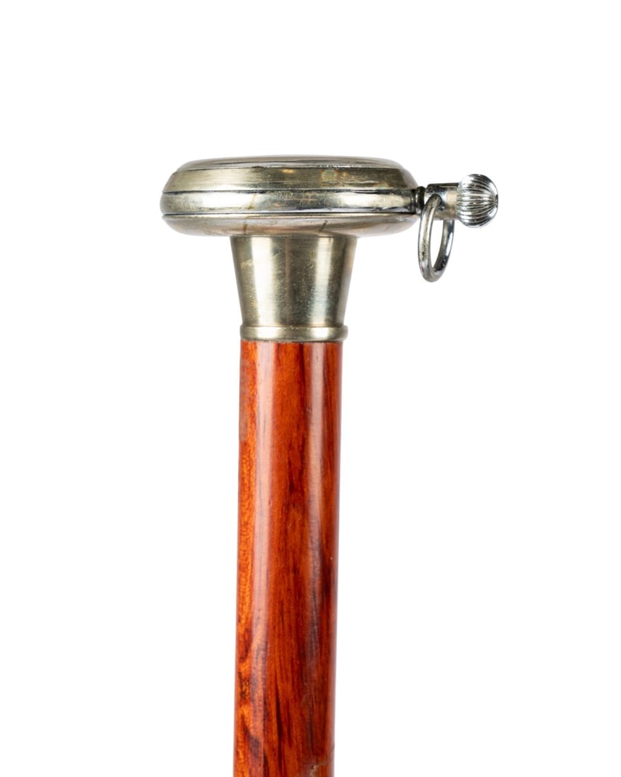 LITTLE MONTE CARLO GAMBLER'S GADGET CANE, C. 1880: English, circa 1880. Gadget cane with a handle containing a wheel encased in silver and glass, wheel can be activated by winding the crown and pressing down, face of the wheel is inscribed "Little Mon