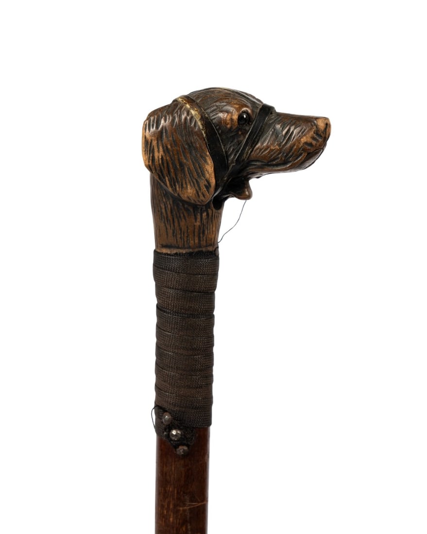 AMERICAN DOG HEAD AUTOMATA CANE, C. 1920: American, circa 1920. Walking cane with automaton hand-carved dog head handle with working mouth, cloth collar secured with three nails, leather throttle wrapped around mouth and ears held with two