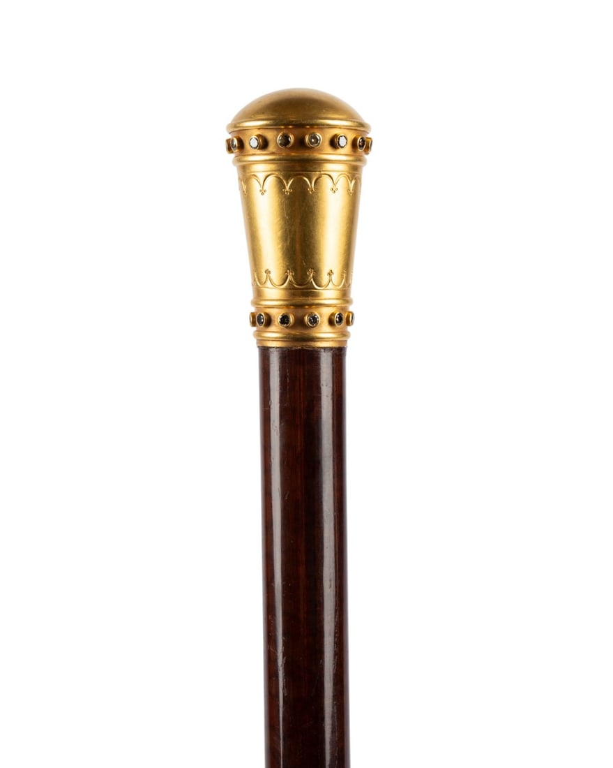 FRENCH DIAMOND DRESS CANE: French, mid-20th century. Walking cane with 22k yellow gold plated knob handle set with a row of fifteen alternating clear and brown diamonds, with frosted gold surface and decorative engraving, with