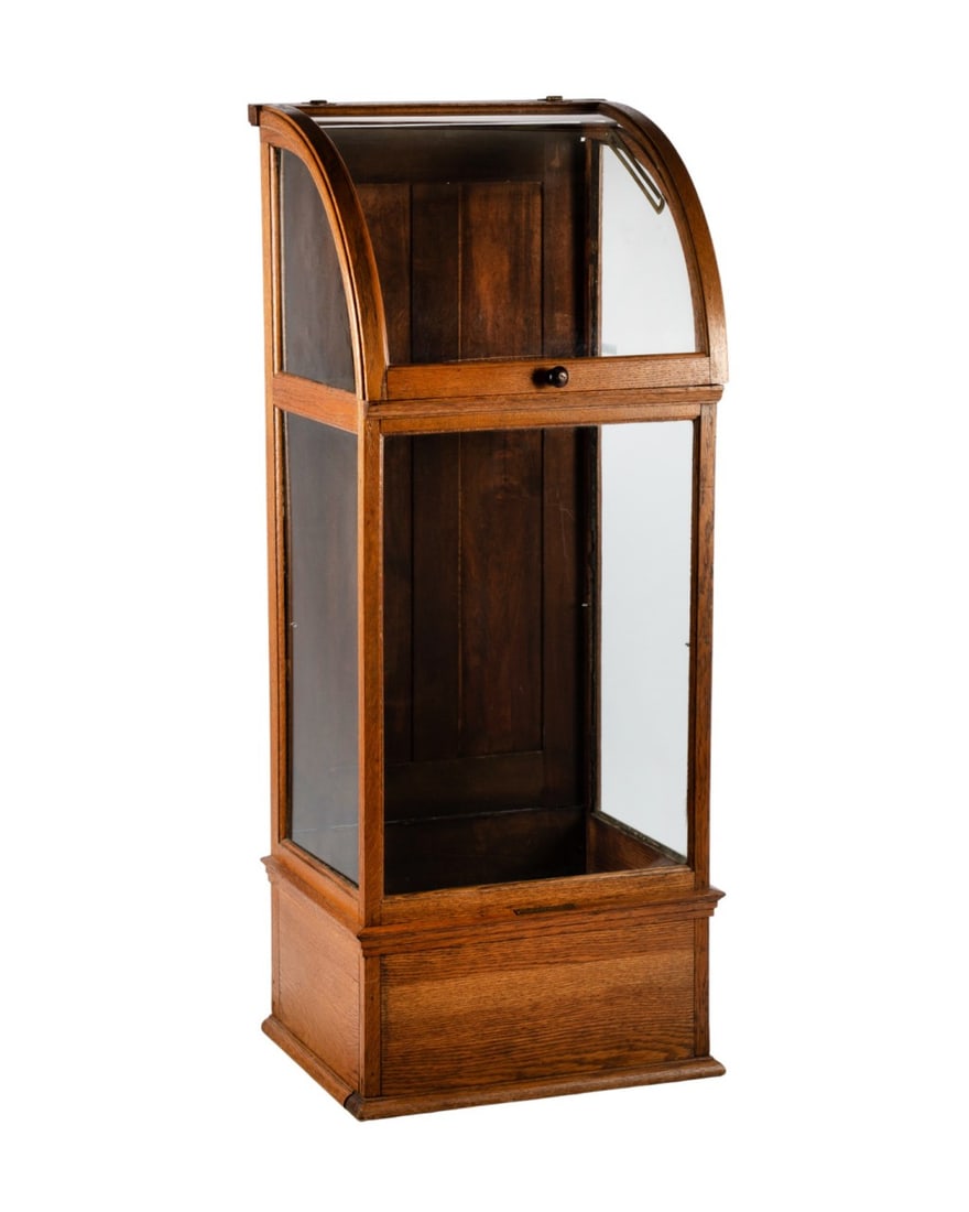 19TH C. OAK WALKING CANE DISPLAY CABINET: Oak cane display cabinet with glass panels on all sides, hinged curved door for easy access, designed to store 46 canes, with metal plaque at the front reading "F.C. Jorgeson & Co. 11 to 17 N Ann