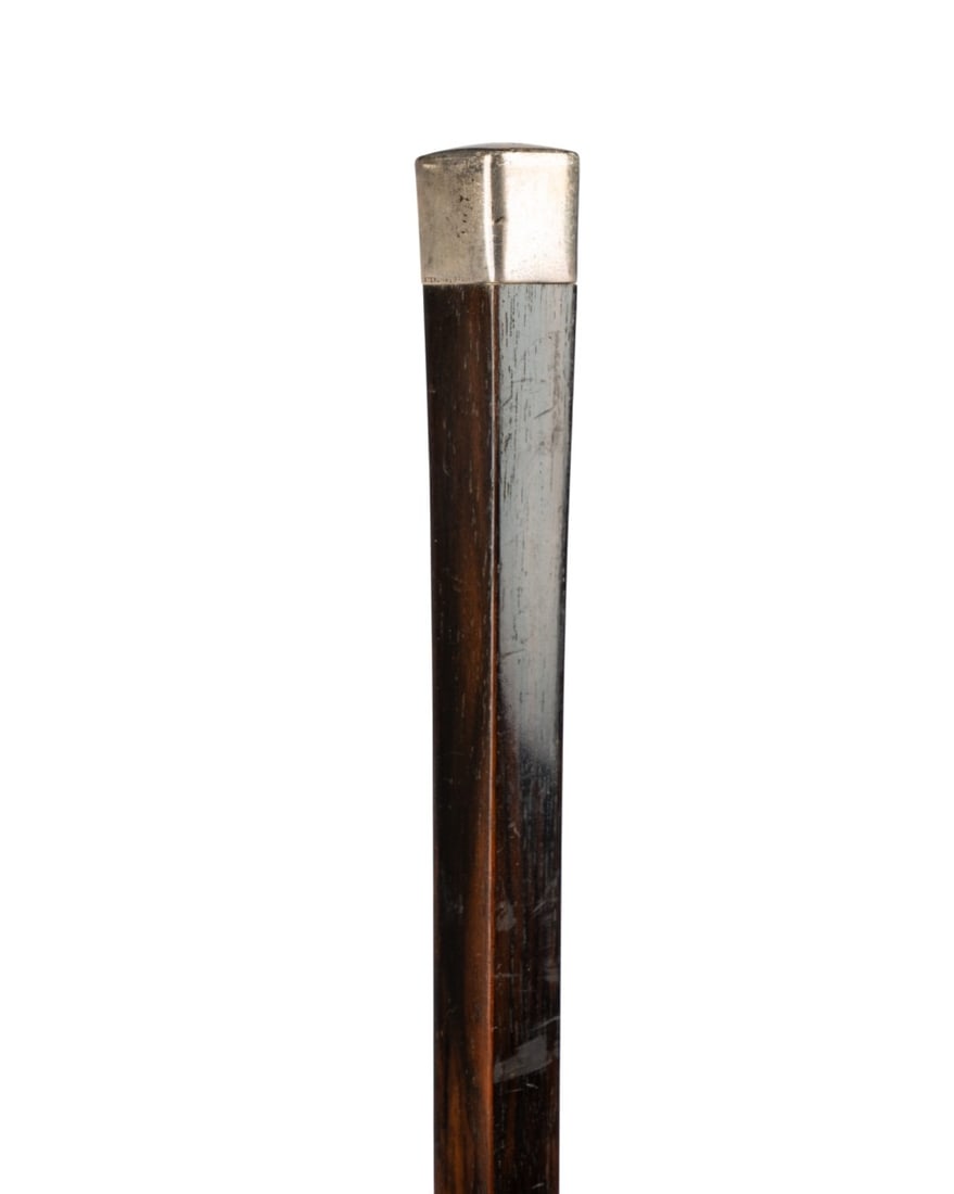 TIFFANY & CO ART DECO DRESS CANE: American, circa 1905. Tiffany & Co. (American, founded 1837). Art Deco dress walking cane with square sterling silver handle, marked ?Sterling? and ?Tiffany & Co.,? with dark-stained Malacca wood shaf