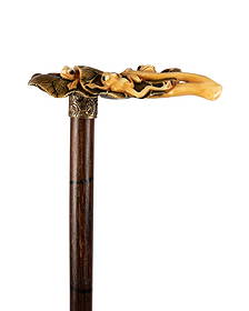 19TH C. JAPANESE FROGS & LILY PAD WALKING CANE: Japanese, circa 1880. Walking cane with Japanese carved handle of three frogs on two large lily pads, signed by the artist, slightly stained in traditional Japanese style, gold-filled collar, stepped