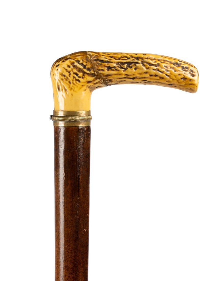 FRENCH PEPPERBOX GUN CANE, C. 1890: French, circa 1890. Pepperbox gun cane with 7" restored celluloid handle simulating stag horn, brass collar, darkly grained Malacca shaft, brass ferrule with steel tip, push-button release at handle,