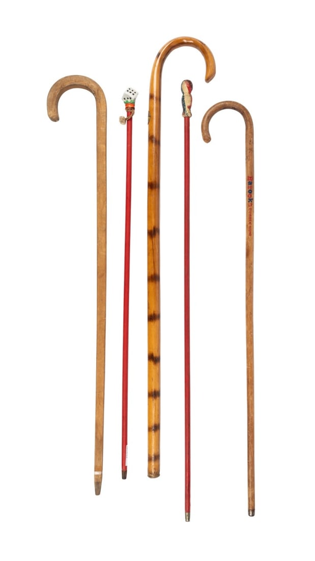 FIVE COMMEMORATIVE WALKING CANES: American, 20th century. Five commemorative walking canes, including a Bazooka Joe Bubble Gum cane, a 1969 Boy Scout Jamboree Idaho cane, a Fat Stock Show Fort Worth Texas cane, a porcelain dice-handle