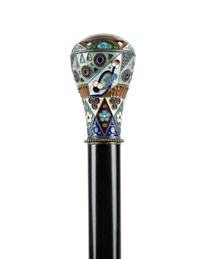 RUSSIAN CLOISONNE ENAMEL WALKING CANE, C. 1910: Russian, circa 1910. Cane with a cloisonne patterned knob handle, a silver top with indecipherable engraving, and an ebonized hardwood shaft tapering to a horn ferrule. Approximate measurements: