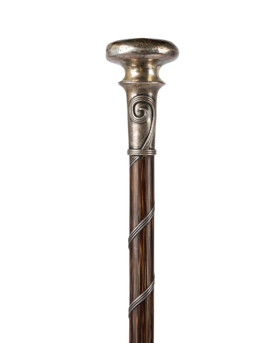 19TH C. ART NOUVEAU STILETTO WALKING CANE: American, circa 1890. Stiletto weapon walking cane with silver-topped handle decorated with Art Nouveau design extending partially down the shaft, top engraved with initials ?JMK,? twisting counter-cl