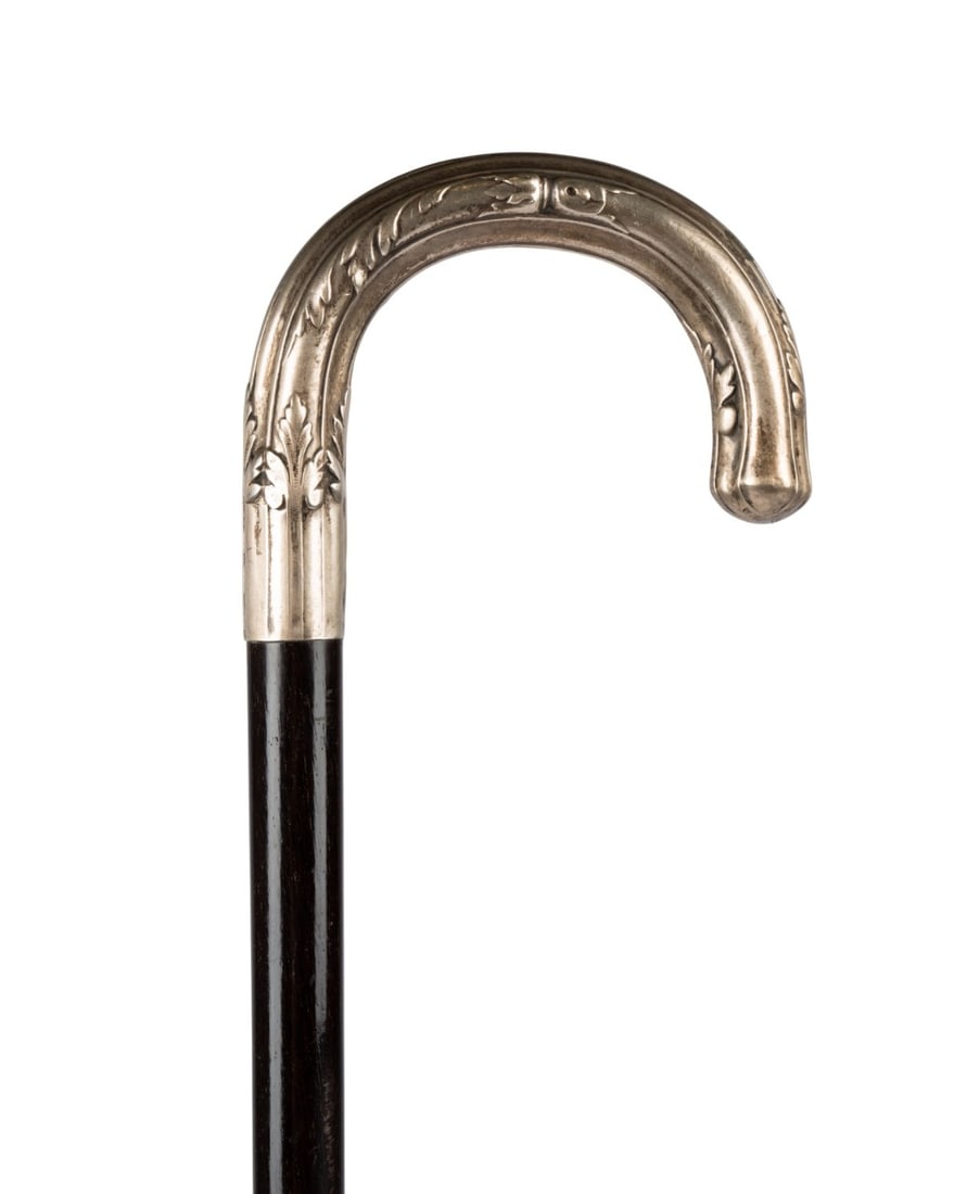 FRENCH ART NOUVEAU SILVER DRESS CANE, C. 1900: French, circa 1900. Walking cane with silver crook handle decorated with simple raised foliate pattern, French marks including "Depose" at base of handle, with mahogany shaft terminating in metal ferr