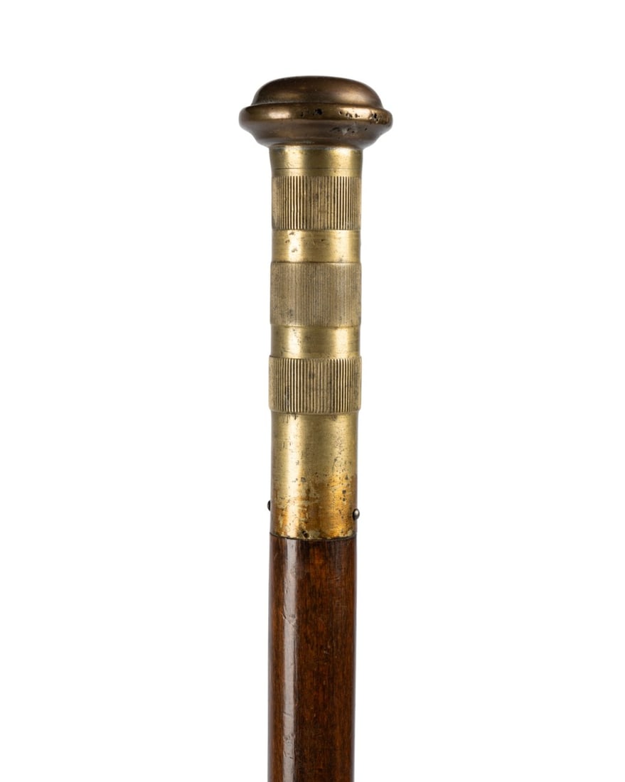 GERMAN TOBACCO LIGHTER GADGET CANE, C. 1900: German, circa 1900. Gadget walking cane with solid brass three piece handle, top section unscrewing to reveal tobacco lighter, second section revealing cotton and fluid storage, beech wood shaft, and
