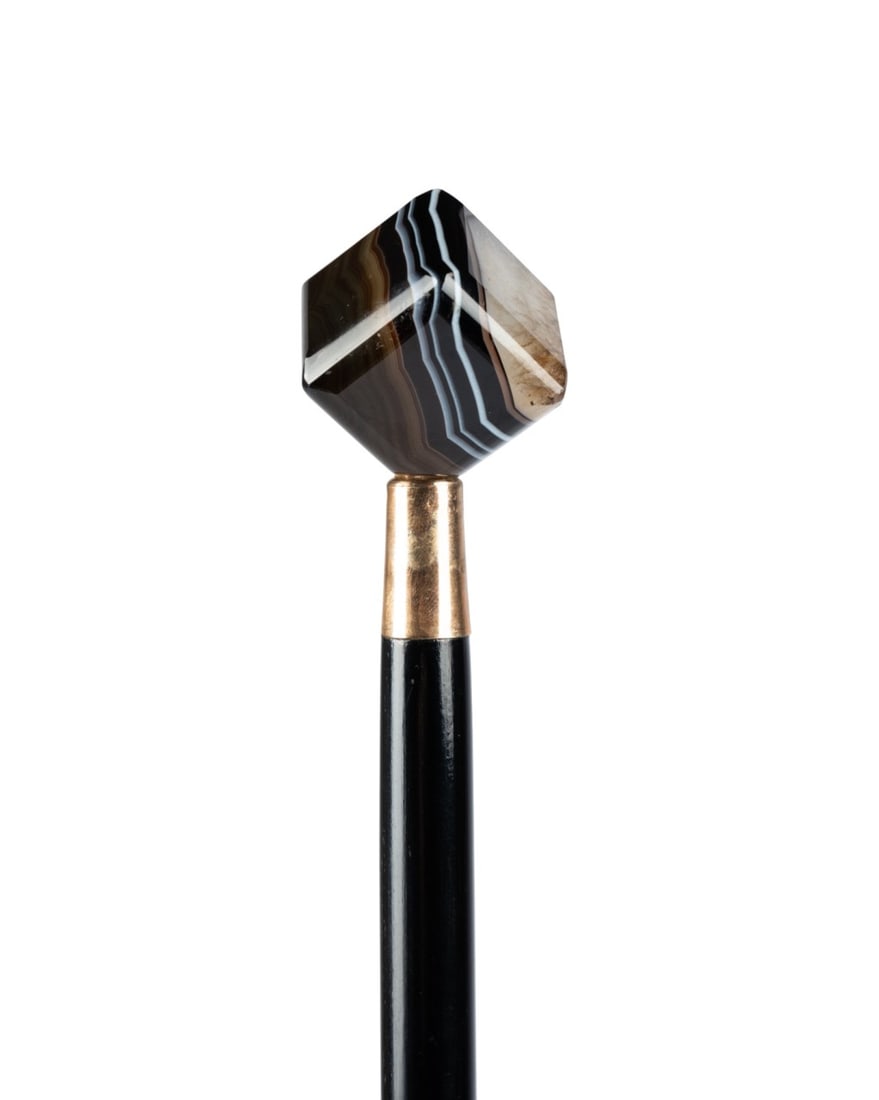 FRENCH ART DECO WALKING CANE, C. 1920: French, circa 1920. Walking cane with cube-shaped stone handle, copper collar, ebonized wood shaft, and brass ferrule. Approximate measurements: length: 35.5"