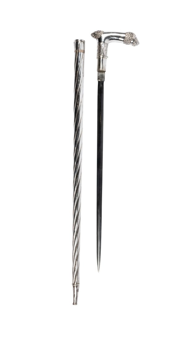 INDIAN STERLING SILVER SWORD WALKING CANE: Indian, circa 1950. Stiletto weapon walking cane with sterling silver handle with lions at each end, connected to sterling silver twisted shaft by latch at collar; removing latch reveals hidden sword
