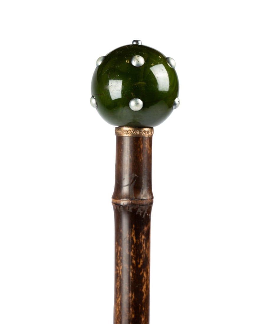 19TH C. FRENCH POISONOUS BLOW DART CANE: French, circa 1880. Poisonous blow dart cane with painted green wood handle with metal dots, brass collar, bamboo shaft, and horn ferrule; handle and ferrule pulling out to reveal hollow shaft for
