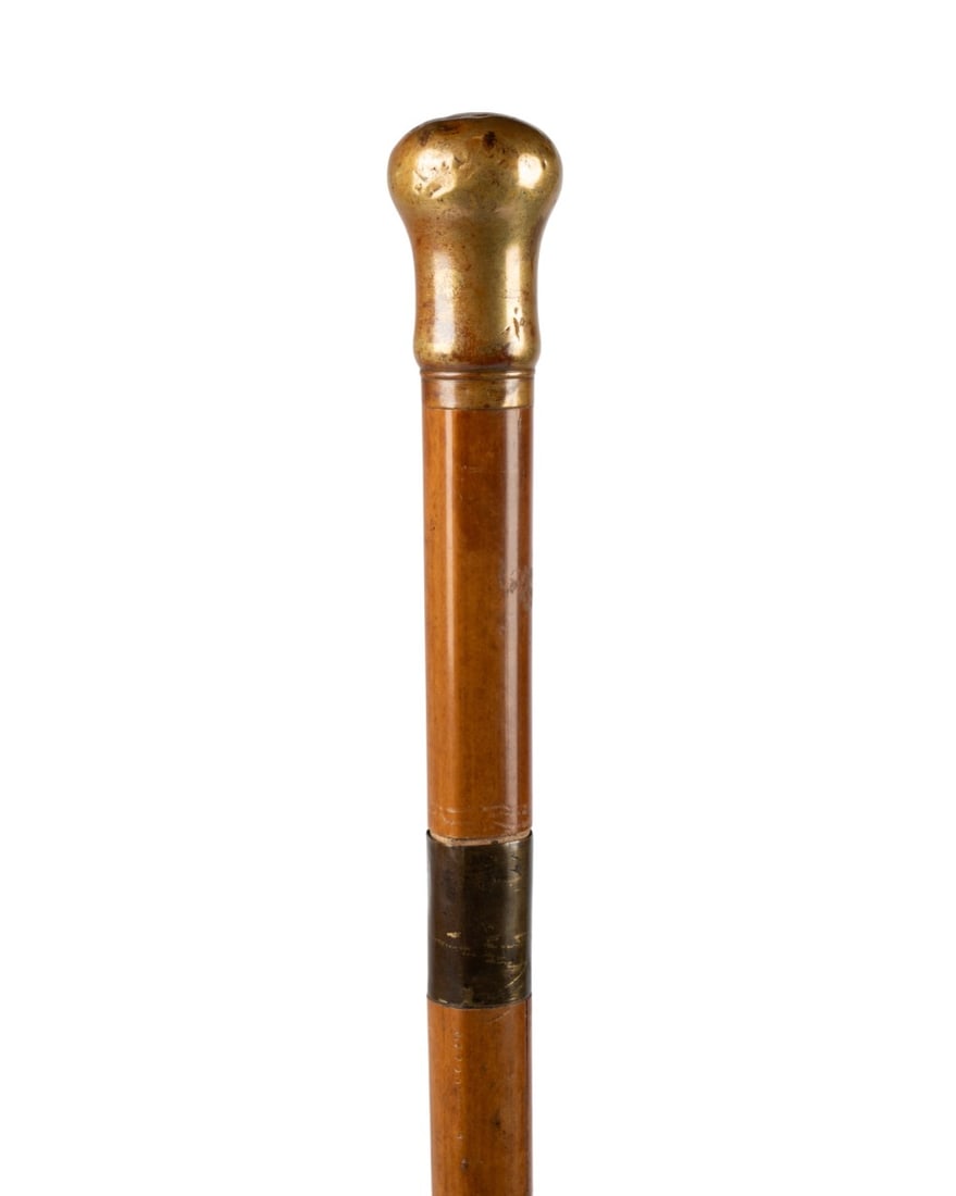 FRENCH LA REDOUBTABLE DEFENSE CANE: French, circa 1860. Weapon and defense cane known as La Redoubtable, with brass knob handle and brass collar, Malacca shaft with brass band below handle, brass ferrule, and concealed mechanism reveali