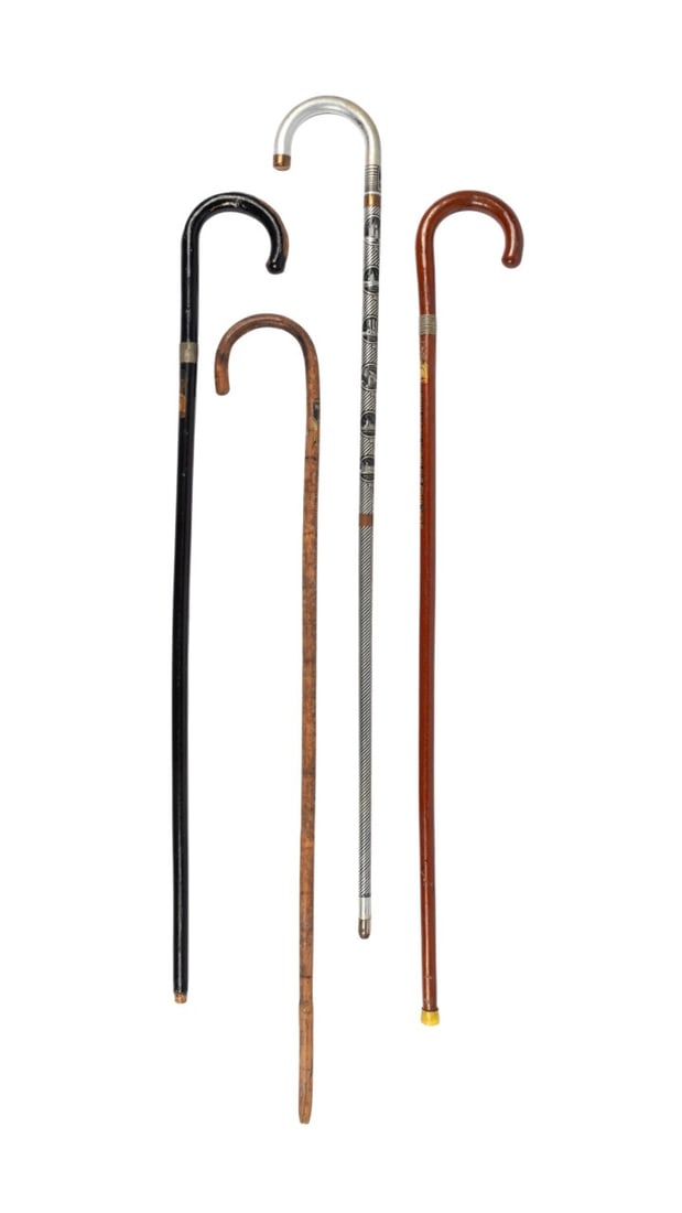 FOUR SOUVENIR WORLD'S FAIR CANES: Four souvenir World's Fair canes, including one cane from the 1934 Century of Progress in Chicago, two canes from the 1939 New York World's Fair, and one cane from the 1940 New York World's Fair. 