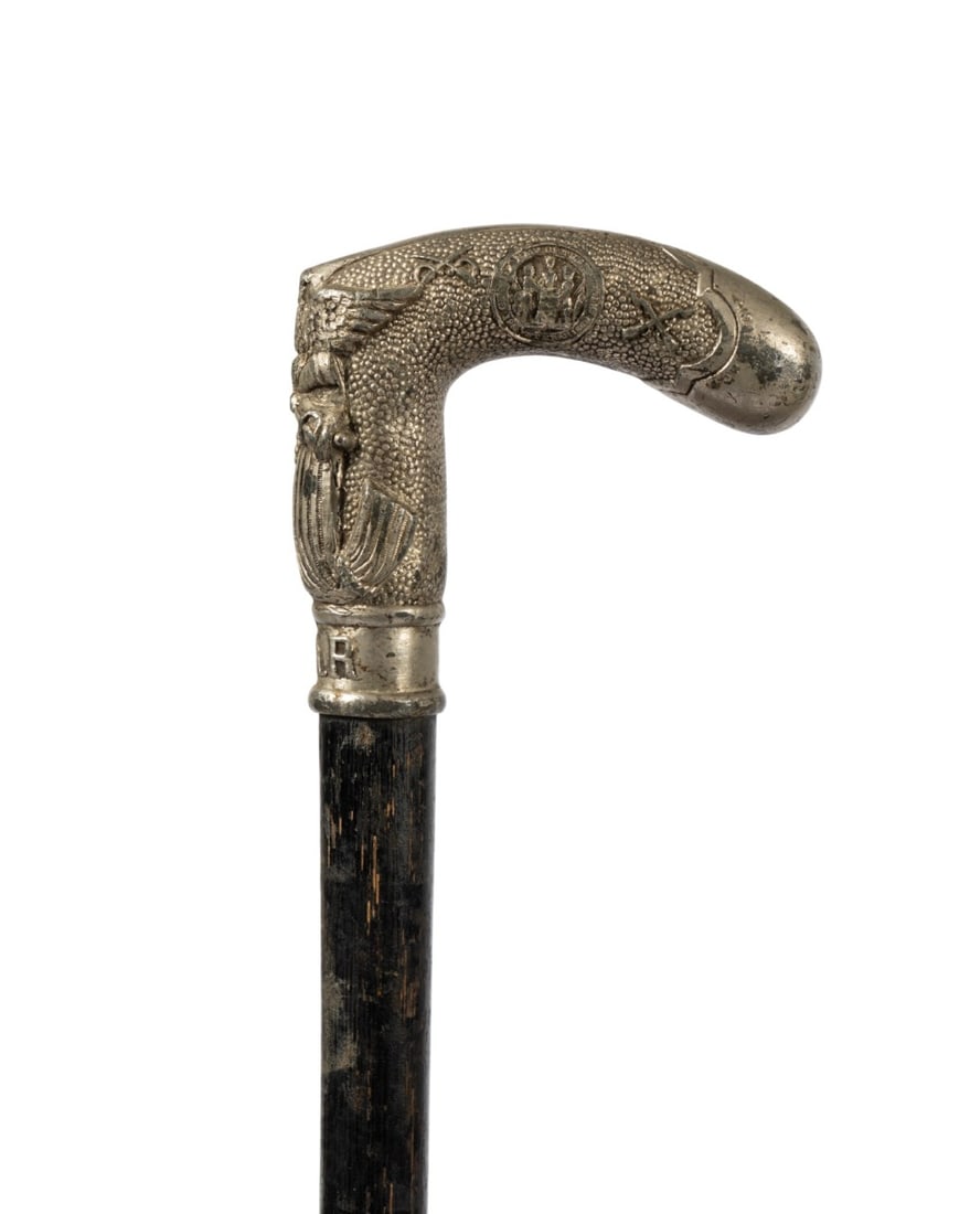 GRAND ARMY OF THE REPUBLIC VETERAN CANE, 1868: American, 1868. Grand Army of the Republic veteran walking cane with metal handle elaborately carved with flag and American eagle, stamped "GAR" at the base and on the shaft with partial date 1868,