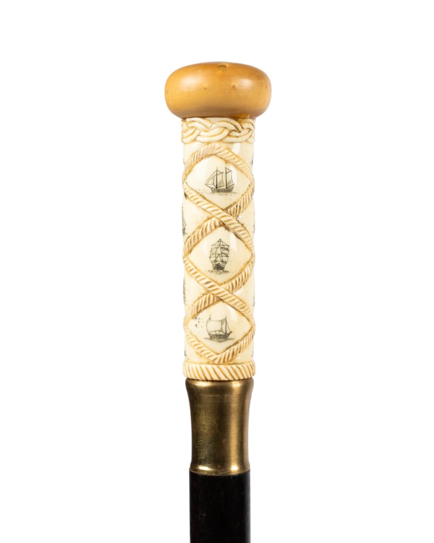 19TH C. SCRIMSHAW HANDLE WALKING CANE: Continental, circa 1890. Walking cane with scrimshaw handle carved with 14 sailing vessels in diamond pattern, mushroom-shaped carved bone knob at top, brass collar, darkly stained hardwood shaft, and