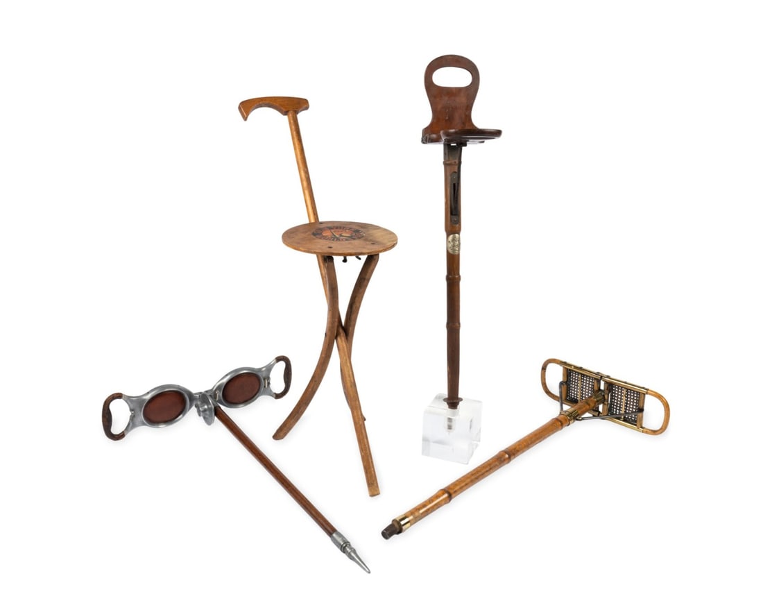 FOUR SEAT GADGET CANES: American / English, 19th-20th centuries. Group of four seat walking canes including a English rattan seat cane, a wooden seat cane, a 1939 New York World?s Fair seat cane, and a leather-topped seat