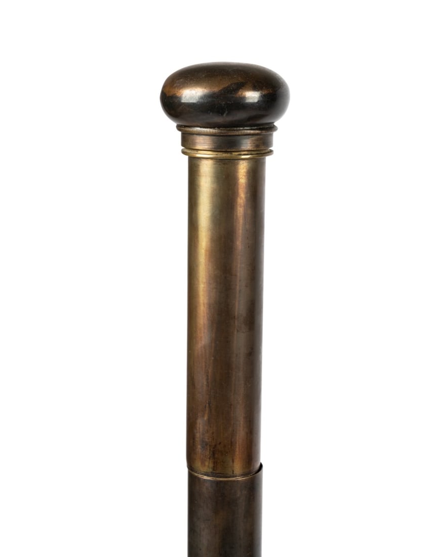 ENGLISH WINSOR & NEWTON ARTIST'S WALKING CANE: English, circa 1870, Winsor & Newton (English, founded 1832). Artist's cane with metal handle, bamboo shaft, unscrewing metal handle revealing aged water bottle with cork stopper, brass cylinder palet