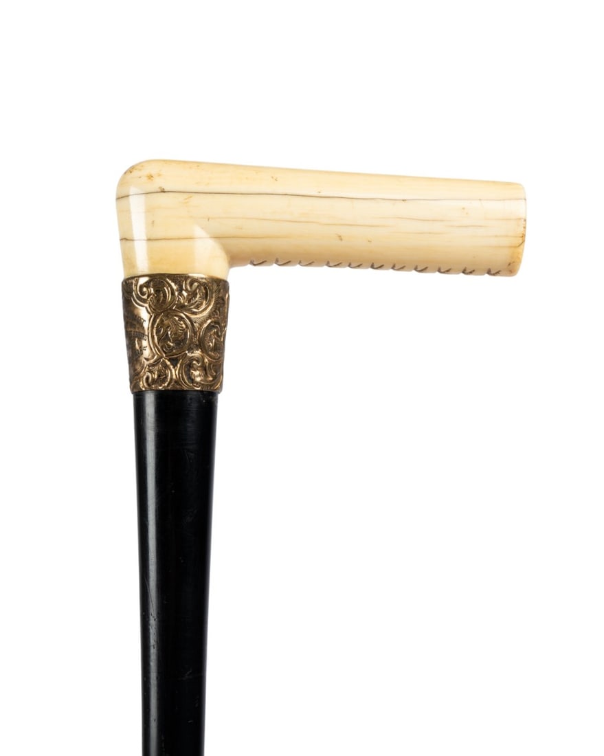 AMERICAN PRESENTATION CANE, 1885: American, 1885. Presentation cane with carved handle, X-pattern underside, gilt collar engraved "To Mr. John Towert from his Brother Office Bearers in Knox?s 25th May 1885", ebony shaft, without